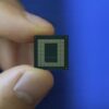 qualcomm snapdragon 888 chip in hand