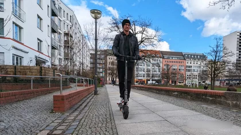 xiaomi electric scooter 4 ultra ridden by a man front